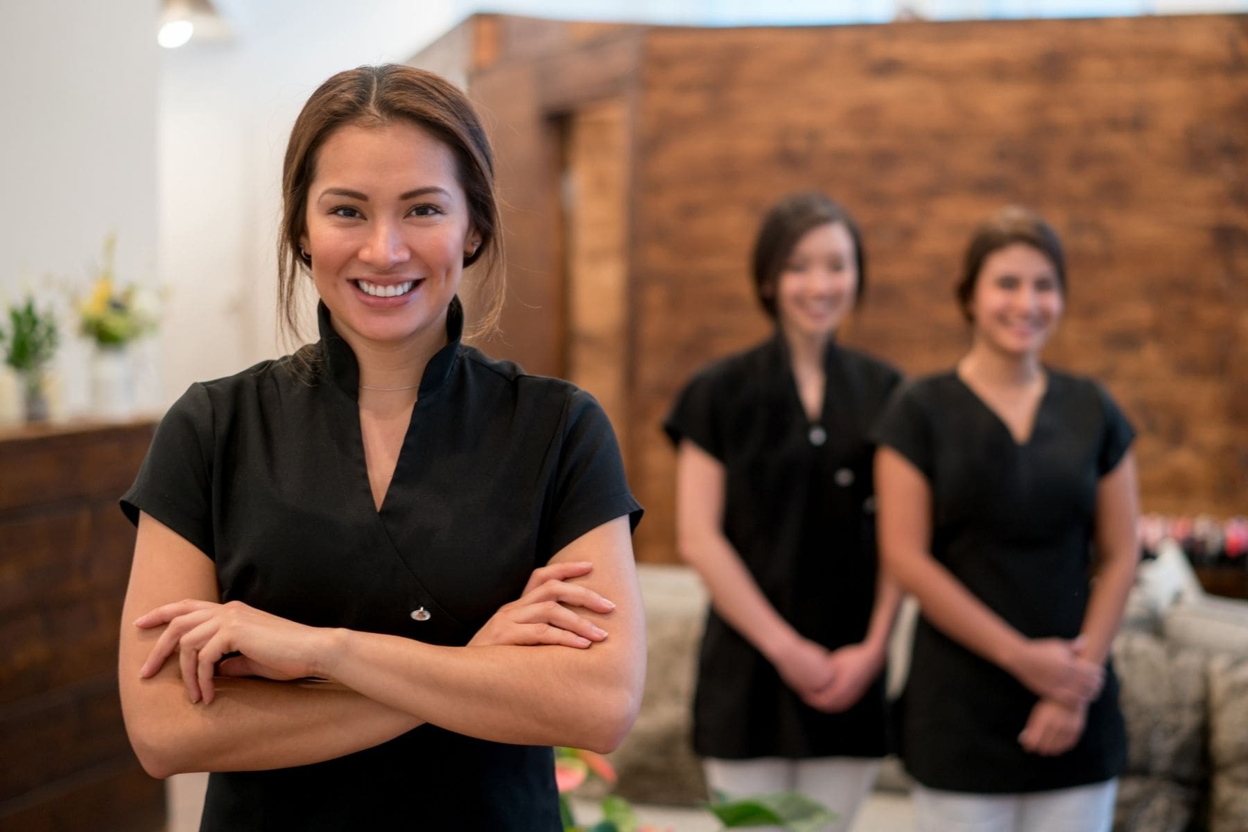 Medspa employees smiling in their front office